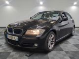 a picture of a black bmw car in a showroom