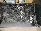 a laptop with a bunch of wires on top of it