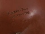a close up of a brown vase with writing on it