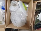 a box full of plastic containers and containers with lids