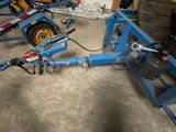 a picture of a blue tow truck with a hose attached to it