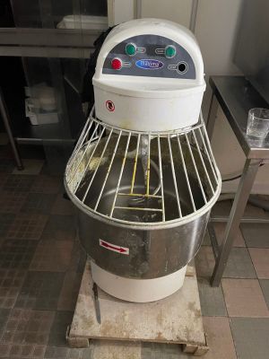 a machine that is sitting on a stand in a kitchen
