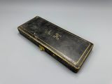 a close up of an old book on a white surface