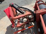 an image of a tractor that is parked on the side of the road