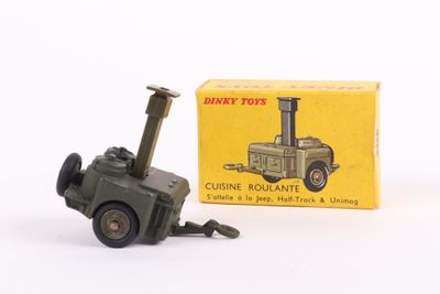 a small toy tractor with a box on a white surface