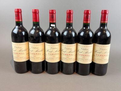 six bottles of red wine lined up in a row