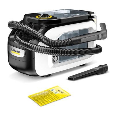 the black and white steam iron is next to a yellow and black pen