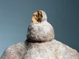 a statue of a man with a hat on it ' s head
