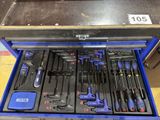 many tools in a blue tool box on the floor