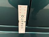 a measuring tape on the side of a green car