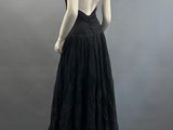 an image of a woman in a black dress on a mannequin