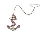 a close up of a necklace with an anchor on it
