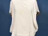 a woman ' s white top on a mannequin mannequin mannequin mannequin mannequin mannequin mannequin mannequin