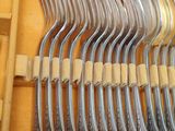 many forks and spoons in a wooden box