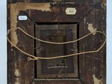 an old wooden picture frame with a rope hanging from it ' s sides