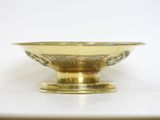 an image of a gold bowl sitting on top of a white table