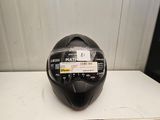 the helmet is black and has a sticker on it