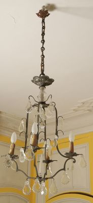 a chandelier hanging from the ceiling in a room