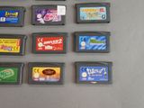 a lot of nintendo game cartridges sitting on a table