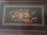 a picture of a wooden table with a floral design on it