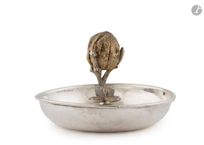 GUCCI Une coupe vide-poche circulaire en métal, la prise en …