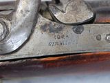 a close up of a gun that is on a table
