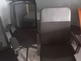 three office chairs in the corner of a room