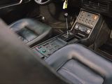 a car dashboard with a control panel and a steering wheel