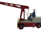 un camion jouet équipé d'une grue à l'arrière