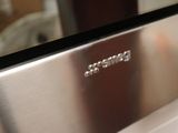 an image of a stainless steel oven with the word beware on it