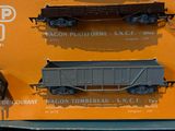 three toy trains on display in a display case