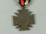 three medals and a medal on a white surface