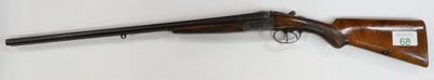 rifle mounted on the wall of a room with a white wall
