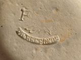 a close up of a white plate with a smiley face on it