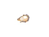 a gold ring with a pearl and blue stones