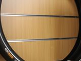 a bicycle tire hanging on a wall in a store