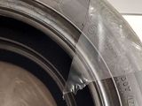 a close up of a tire on a white surface