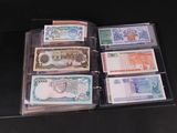 five different bills in a folder on a black table