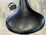 a black seat on a black chair in a room