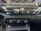 a dashboard of a car with a steering control in it
