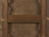 an old picture of a wooden frame with a hole in it