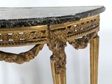 a table with a marble top and a gold frame