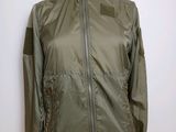 the jacket is green and has a zipper on the front