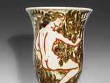 a vase that has a picture of a woman on it