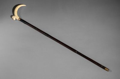 a close up of a wooden stick with a crescent on it