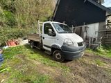 a white truck that is parked in the yard