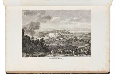 un vieux livre sur lequel figure un dessin représentant une vue d'une ville