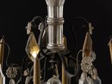 a chandelier that has a lot of glass hanging from it