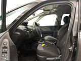 the interior of a car with the door open showing the driver ' s seat