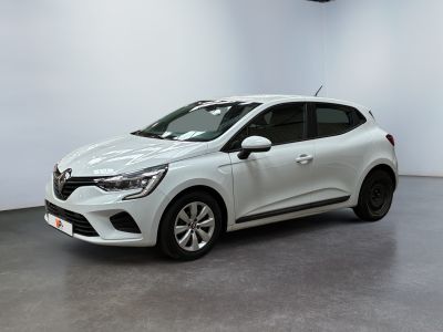 a white car in a white room with a black floor